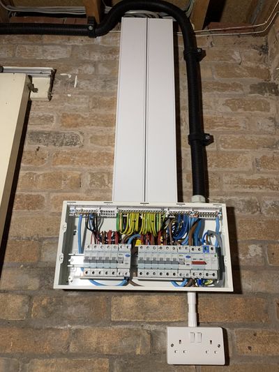 Consumer unit replacement and wiring tidy up in a garage