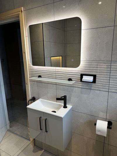 Ensuite mirror and toothbrush charger in Congleton
