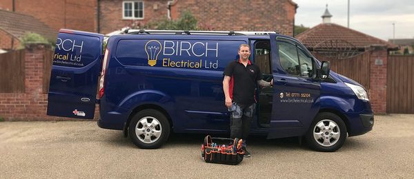 Glenn Birch standing beside the Birch Electrical Ltd van